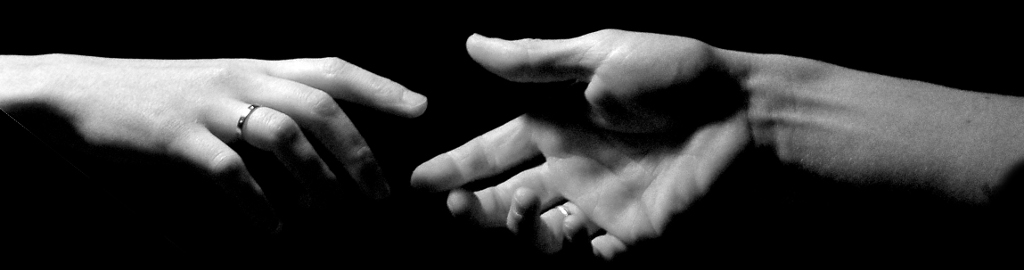 Two hands reach out to handshake.