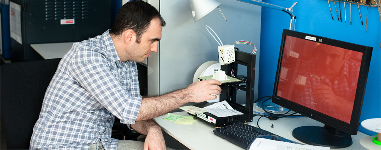 Photo of a Microsoft employee looking at a computer