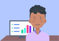 District admin standing in front of a computer with charts on the screen