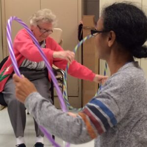seniors exercise with hula hoops
