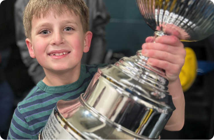 Child holding a trophy