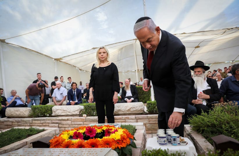 Prime Minister Benjamin Netanyahu his wife Sara, family and friends attend a memorial ceremony for Netanyahu's brother, Yoni Netanyahu, at the Mount Herzl Military Cemetery, in Jerusalem, on June 16, 2021.