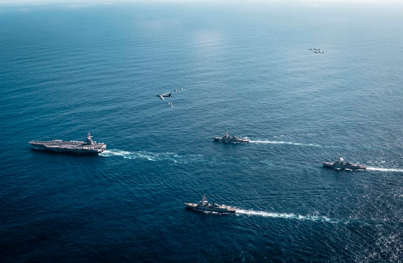 The US Navy's Gerald R. Ford Carrier Strike Group operates as a joint, multi-domain force with a U.S. Air Force B-52 Stratofortress, November 13, 2025.