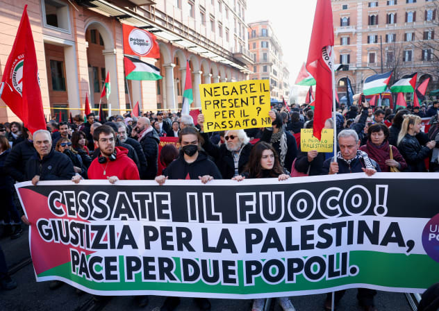  Pro-Palestinian protestors hold a banner during a demonstration demanding an immediate ceasefire in Gaza, as the conflict between Israel and the Palestinian Islamist group Hamas continues, in Rome, Italy, January 27, 2024. The banner reads: "Cease fire! Justice for Palestine, peace for two peoples