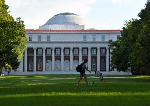  Students crossing the lawn in front of the Faye and Joe Wyatt Center for Education on the campus of Peabody College at Vanderbilt University in Nashville, Tennessee, U.S., September 18, 2018. 