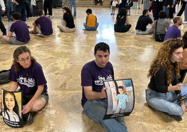  Activists with the group Standing Together hold a silent protest at the University of Haifa in April 2025. 