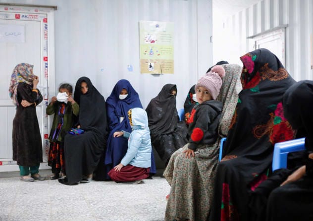 Afghan women and children wait for their turn to see a doctor at Yaka Dokan health clinic run by nonprofit organization World Vision, in Yaka Dokan village, Herat, Afghanistan