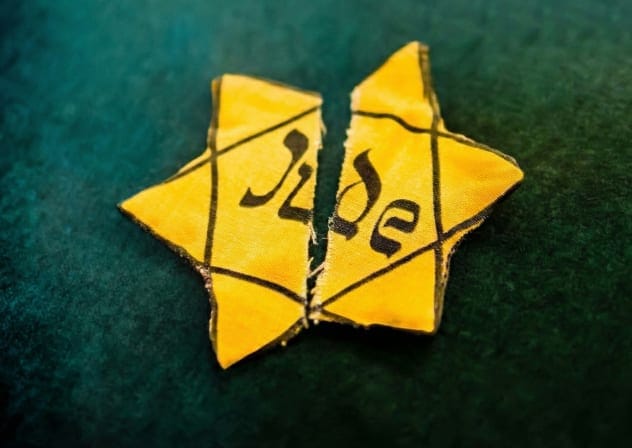 How do you define a 'half-Jew?' A torn yellow Star of David, worn by Jews during the Holocaust in Nazi Germany.