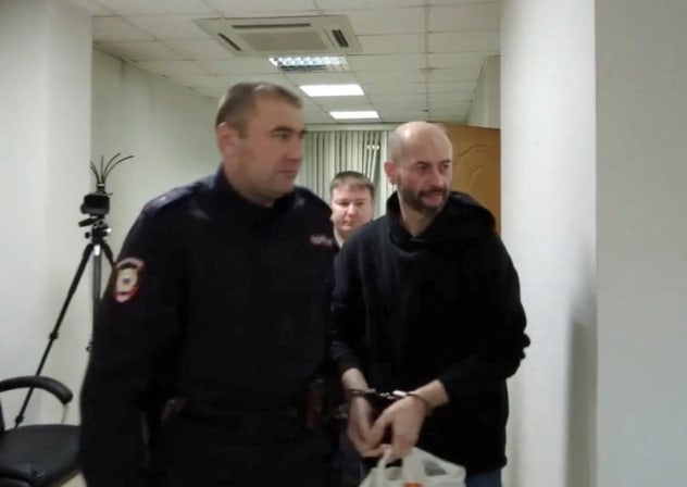 Belarusian citizen Sergei Yeremeyev, who is accused of carrying out an act of terrorism and of planting explosives on two freight trains in Russia's Buryatia region on the orders of Ukraine's intelligence services in 2023, attends a court hearing in Chita, Russia.