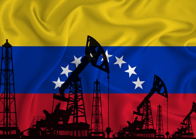 An illustration of oil rigs over a background of a Venezuelan flag.