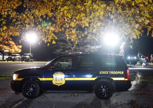 Delaware State Police officers standby as former US president Joe Biden arrives on Marine One to Brandywine Creek State Park in Wilmington, Delaware, US, November 19, 2021.