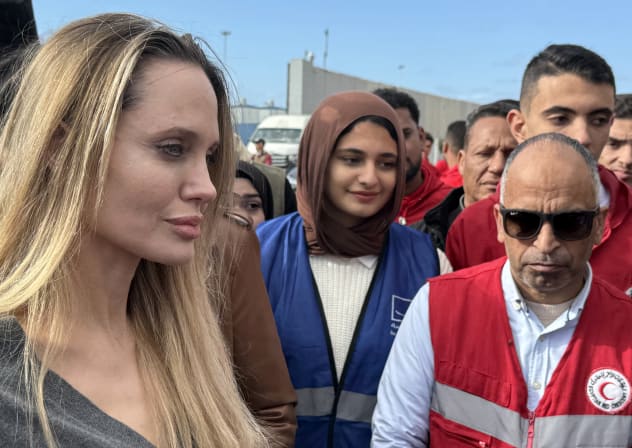 US  actress Angelina Jolie meets with employees of the Egyptian Red Crescent at the Egyptian Rafah border crossing, part of her visit to the North Sinai Governorate to inspect aid entering the Palestinian Gaza Strip, on January 2, 2026