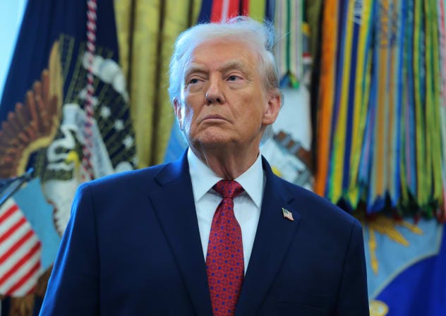 US President Donald Trump listens during a ceremony for the presentation of the Mexican Border Defense Medal in the Oval Office of the White House on December 15, 2025 in Washington, DC.