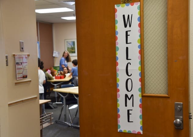 A welcome sign is seen on the door of a classroom at Nora Sterry Elementary School as students relocated from Marquez Elementary, destroyed in the Palisades Fire, begin class at the school in Los Angeles, January 15, 2025.