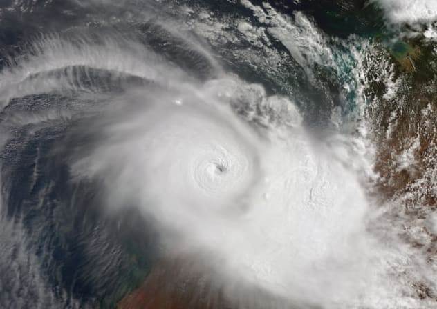 FILE PHOTO:  Satellite view of Tropical Cyclone Zelia, a powerful Category 5 cyclone impacting the coast of Western Australia near Port Hedland, disrupting major iron ore exports. Imaged 13 February 2025. 