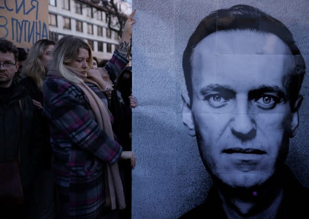 People gather outside the Russian embassy, following the death of Russian opposition leader Alexei Navalny, reported by prison authorities in Russia's Yamalo-Nenets region where he had been serving his sentence, in Warsaw, Poland, February 16, 2024. 