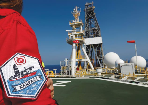 A TURKISH petroleum engineer poses on the helipad of Turkish drilling vessel ‘Yavuz’ in the eastern Mediterranean Sea off Cyprus. 