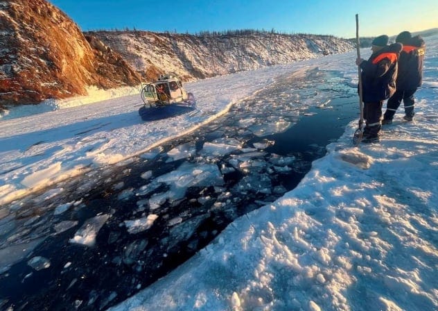 Rescuers work at the scene after a tour bus carrying Chinese tourists plunged into the ice‑covered waters of Lake Baikal in the Irkutsk region, Russia, February 20, 2026.