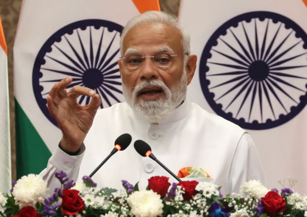 India's Prime Minister Narendra Modi speaks at a press event as he delivers joint declarations alongside France's President Emmanuel Macron in Mumbai on February 17, 2026; illustrative.