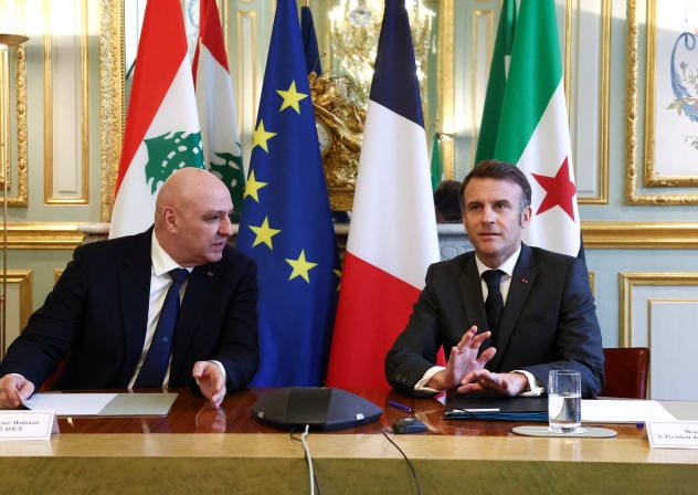 French President Emmanuel Macron and Lebanese President Joseph Aoun attend a meeting with Syria's interim President Ahmed al-Sharaa joining remotely, during a visit at the Elysee Palace in Paris, France, March 28, 2025.