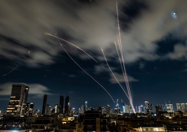 Anti-missile batteries fire interception missiles toward incoming ballistic missiles launched from Iran, as seen over Tel Aviv, during the war with Iran and ongoing missile fire toward Israel, March 7, 2026.