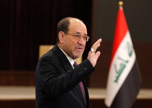 Former Iraqi Prime Minister Nouri al-Maliki leaves after casting his ballot at a polling station in Baghdad on November 11, 2025 during Iraq's parliamentary elections.