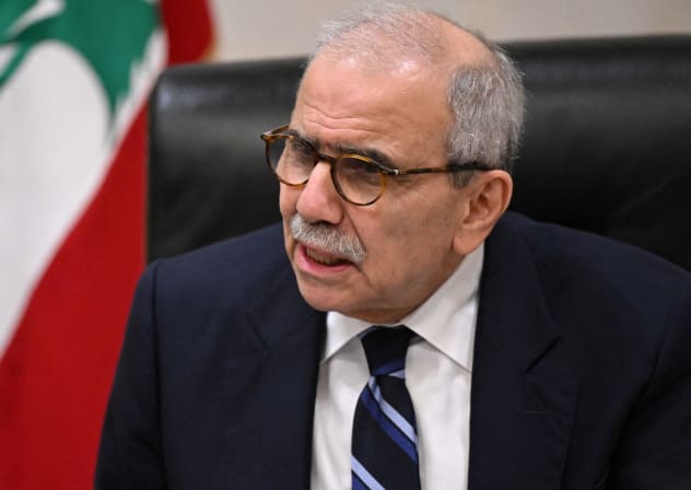 Lebanon's Prime Minister Nawaf Salam speaks to journalists working for foreign media and news agencies at the Government Palace in Beirut on December 3, 2025.