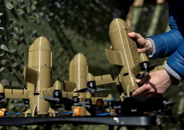 A person holds a Sting interceptor drone by the Ukrainian company Wild Hornets at an undisclosed location in Ukraine, March 16, 2026