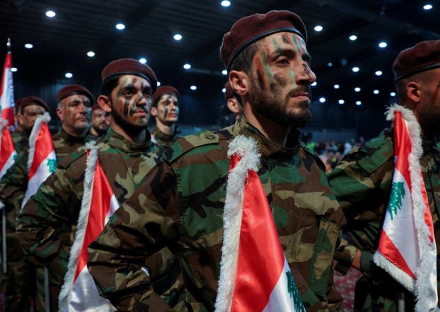  Hezbollah members parade during a rally marking al-Quds Day, (Jerusalem Day) in Beirut's southern suburbs, Lebanon April 5, 2024. 