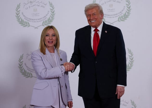 US President Donald Trump and Italian Prime Minister Giorgia Meloni shake hands as they pose for a photo, at a world leaders' summit on ending the Gaza war, amid a U.S.-brokered prisoner-hostage swap and ceasefire deal between Israel and Hamas, in Sharm el-Sheikh, Egypt, October 13, 2025.