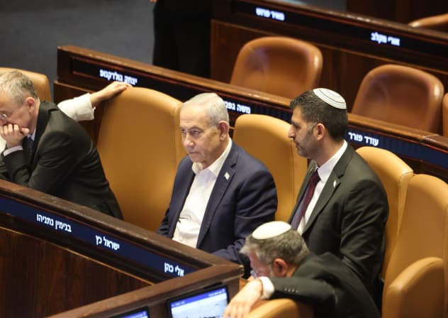 Prime Minister Benjamin Netanyahu and Communications Minister Shlomo Karhi are seen in the Knesset plenum during a vote on the minister's communications reform, in Jerusalem, July 16, 2026