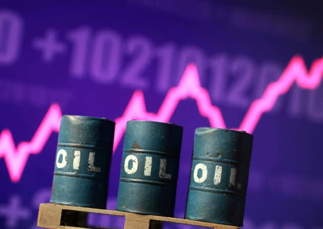 3D printed oil barrels and rising stock graph are seen in this illustration taken March 23, 2026.