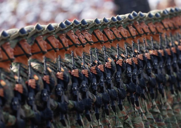 China's Information Support Force (ISF) personnel march during a military parade to mark the 80th anniversary of the end of World War Two, in Beijing, China, September 3, 2025.