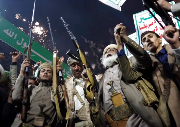  Protesters who support Yemen's Houthi group brandish weapons and shout slogans as they celebrate the ban decision imposed against the maritime shipping of Saudi Arabia on July 20, 2026 in Sana'a, Yemen. 