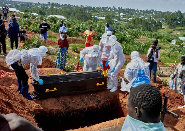  Red Cross workers wearing personal protective equipment (PPE) prepare to lower the coffin of Dr Tibenderana Katho Blaise, who worked at the Centre Medical Evangelique (CME) in Hoho commune and died of Ebola virus in Ituri province, Democratic Republic of Congo, May 26, 2026.