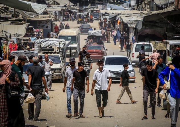 Palestinians are seen walking in Khan Yunis, southern Gaza Strip, August 12, 2026