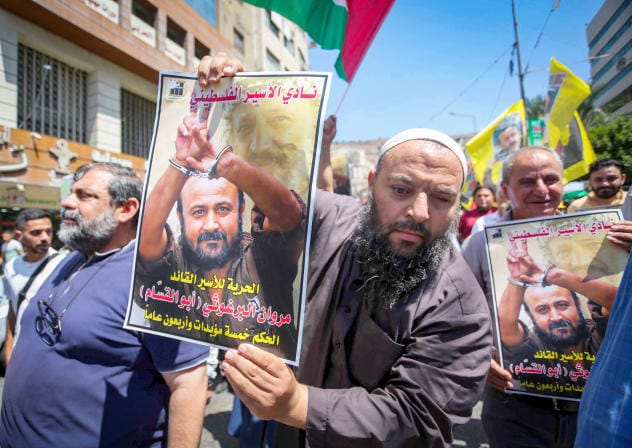 Palestinians protest in support of senior Fatah leader Marwan Barghouti in the West Bank city of Nablus, August 20, 2025