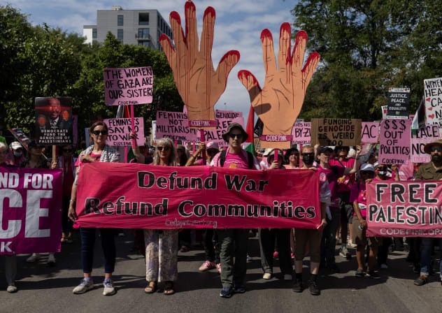 Code Pink activists take part in a pro-Palestinian march on the sidelines of the Democratic National Convention (DNC), in Chicago, Illinois, US, August 19, 2024.