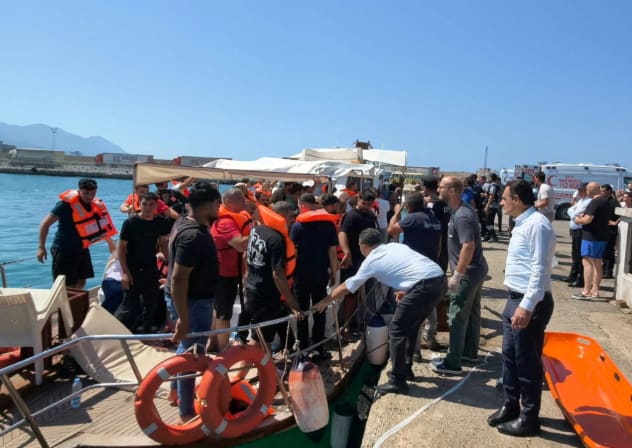 Survivors arrive on shore after being rescued from the sea following a boat capsize off Kyrenia, northern Cyprus, August 30, 2026