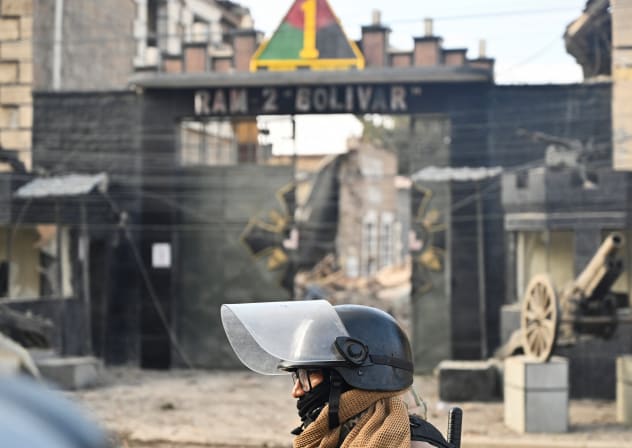 A military officer walks through the affected area a day after loud explosions that left people dead and injured at a military barracks, in Viacha, Bolivia, September 5, 2026.