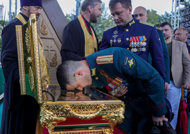 FILE PHOTO: A Russian Army officer leans to a case with relics of a medieval Russian prince Dmitry Donskoy during a citywide procession marking the Feast of the Moscow Saints in Moscow, Russia, September 6, 2026.