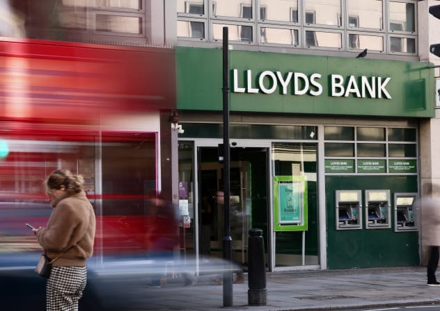 A bus drives past a branch of Lloyds Bank in London, Britain, January 28, 2026.