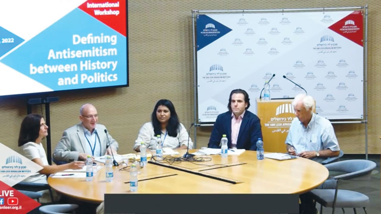  THE WRITER (left) and other panelists deliberate at the recent international workshop at the Van Leer Institute in Jerusalem. 