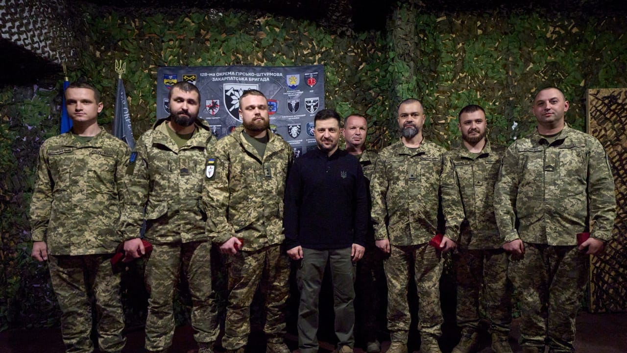 Ukraine's President Volodymyr Zelenskiy poses for a picture with service members while he visits a command position of the 128th Zakarpattia Separate Mountain Assault Brigade at a front line, amid Russia's attack on Ukraine, in Zaporizhzhia region, Ukraine November 13, 2025.