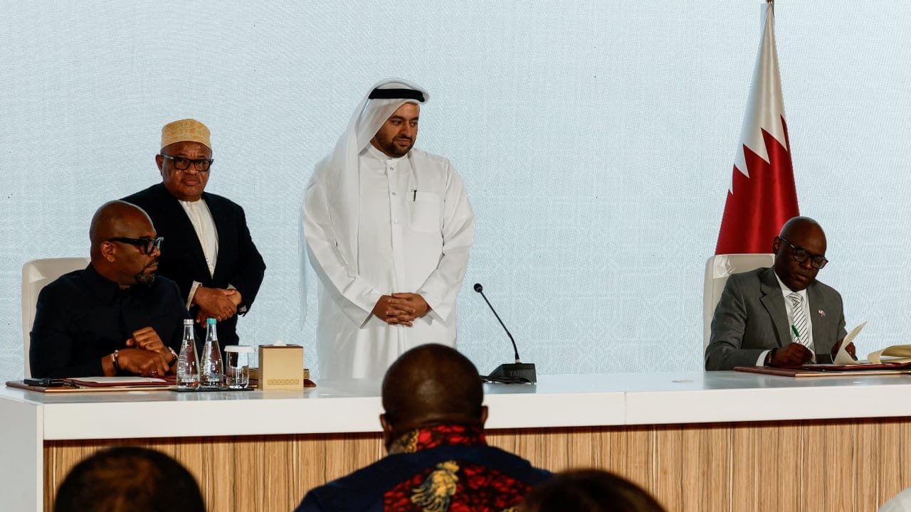 Congo's President Felix Tshisekedi's high representative Sumbu Sita Mambu and head of the M23 rebel group delegation Benjamin Mbonimpa sign a framework agreement for a peace deal aimed at ending fighting in eastern Congo, during a ceremony in Doha, Qatar, November 15, 2025.
