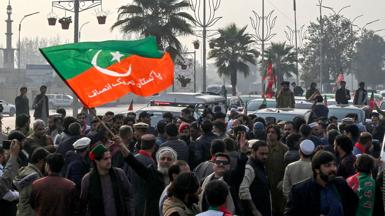 Pakistan Tehreek-e-Insaf (PTI) party supporters protest to demand release of their jailed leader and Pakistan's former Prime Minister Imran Khan, in Peshawar on December 2, 2025. 