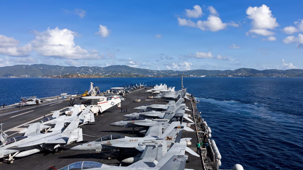 The top deck of US Navy's USS Gerald R. Ford aircraft carrier, with fighter jets, December 1, 2025; illustrative.