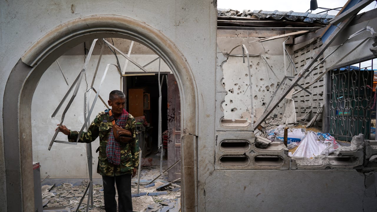 Sopee Kunkem, 65, walks during an interview with Reuters inside his damaged house amid deadly clashes between Thailand and Cambodia along a disputed border area in Sa Kaeo province, Thailand, December 10, 2025.