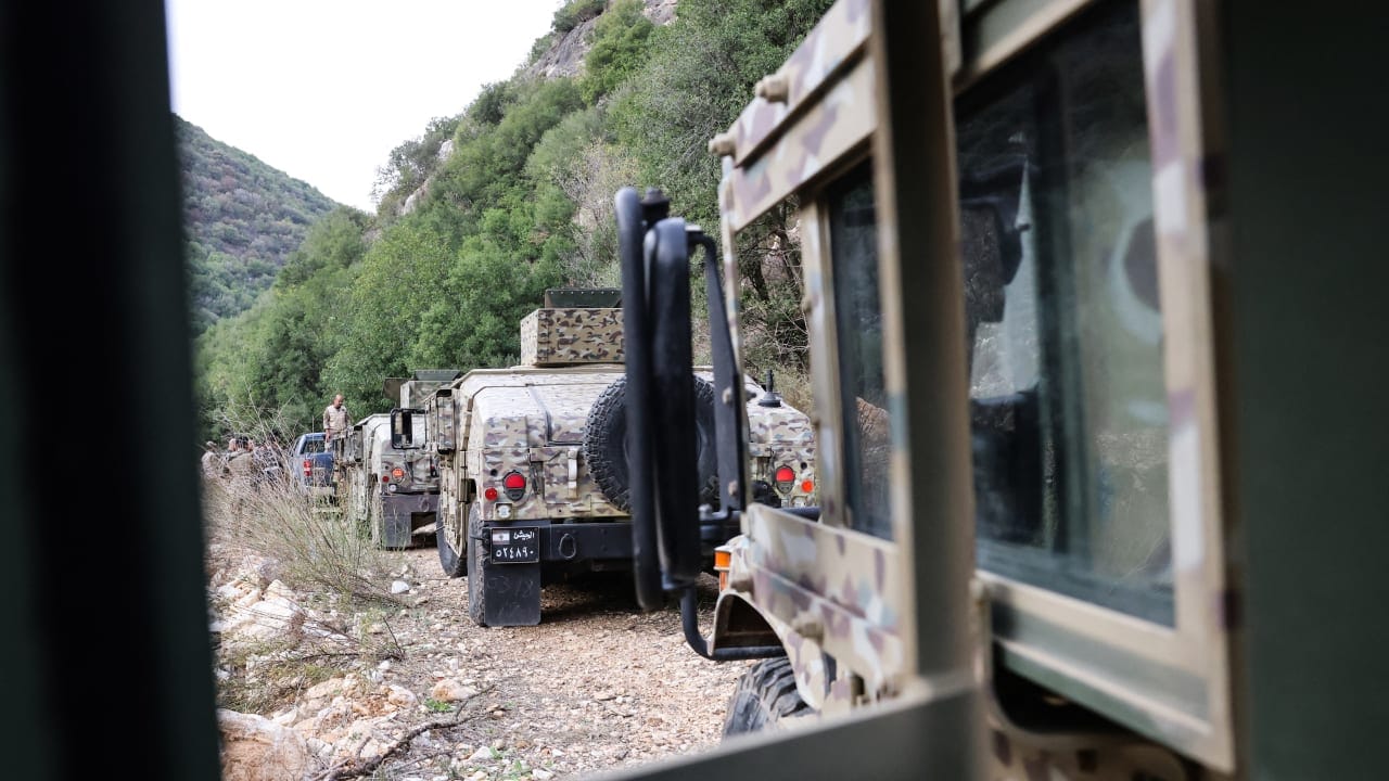 This photograph taken during a press tour organised by the Lebanese army shows a military convoy heading to an abandoned tunnel (unseen) said to have been used by Hezbollah, in a mountainous valley on the outskirts of the southern village of Zibqin, on November 28, 2025.