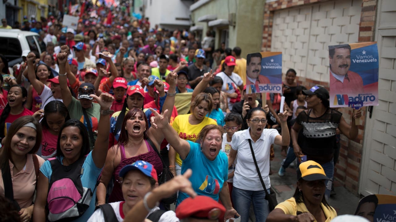 Supporters of Venezuela's President Nicolas Maduro shout slogans during a campaign rally in Caracas